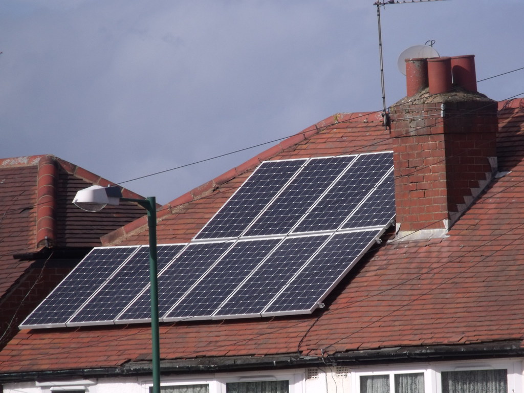 Solar panels installed on a residential rooftop, the kind of installation Colorado HOAs cannot legally block